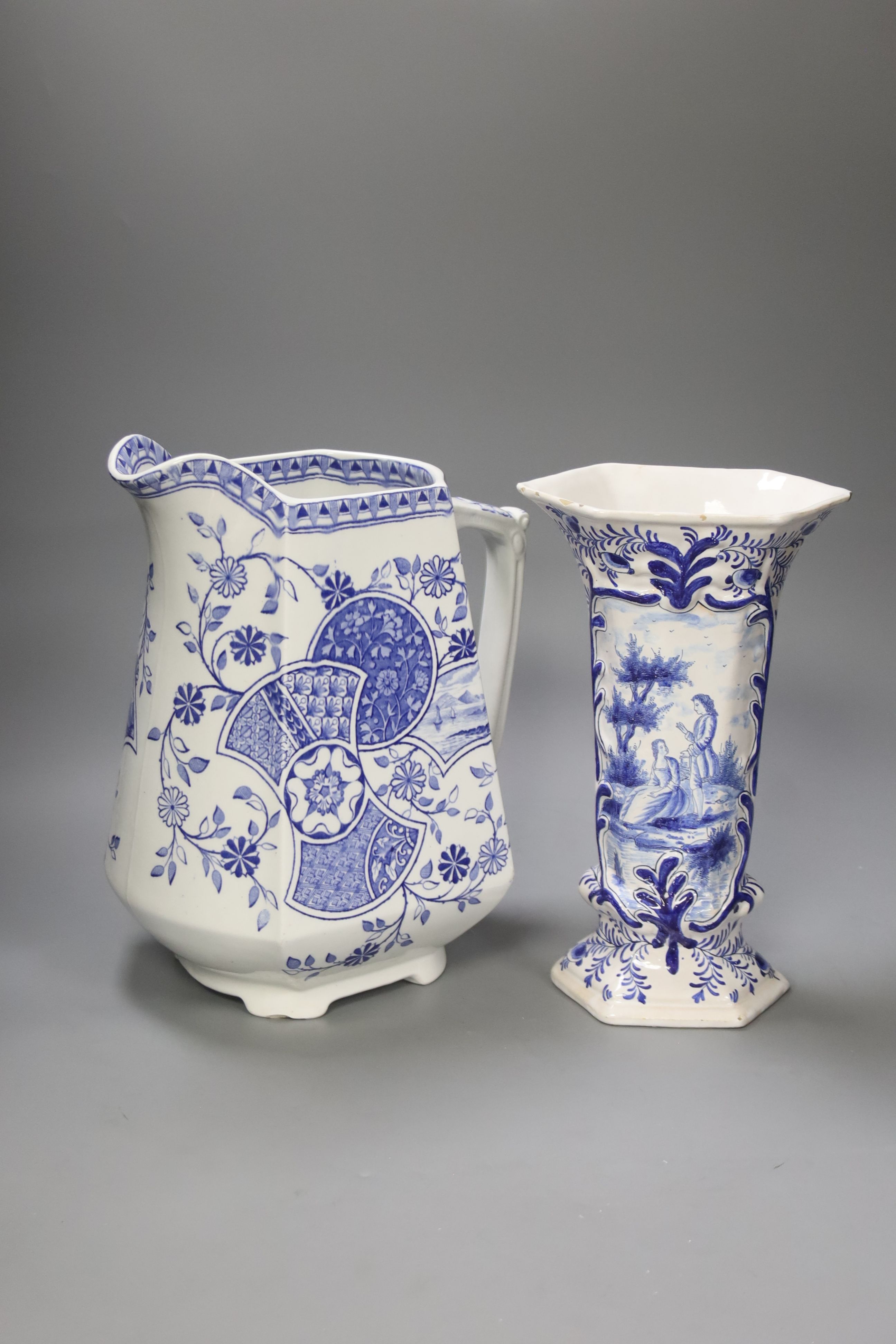 A Blenheim patterned blue and white jug and a Delft vase, tallest 29cm